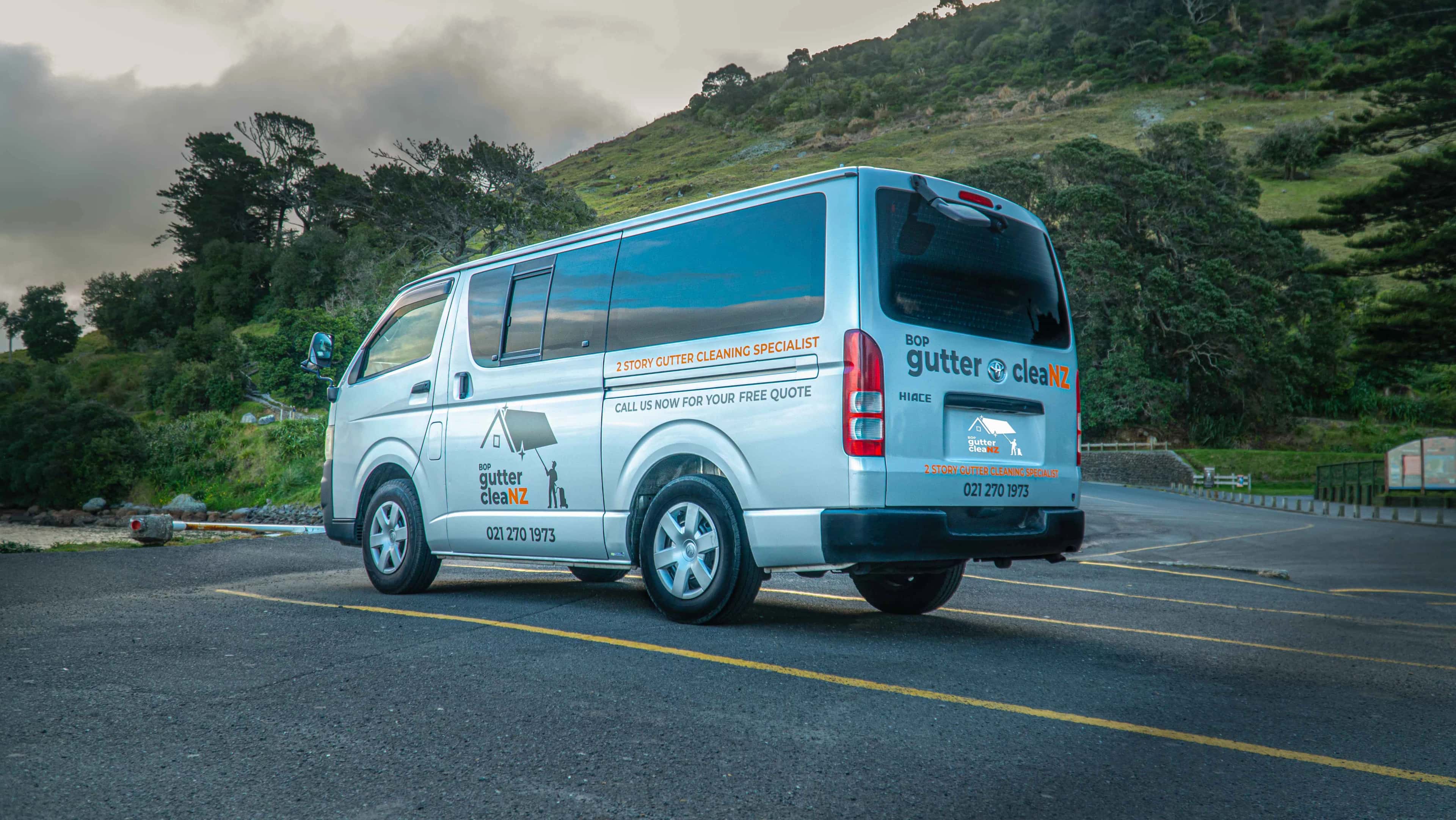 BOP Gutter CleaNZ van parked below a Bay of Plenty hillside